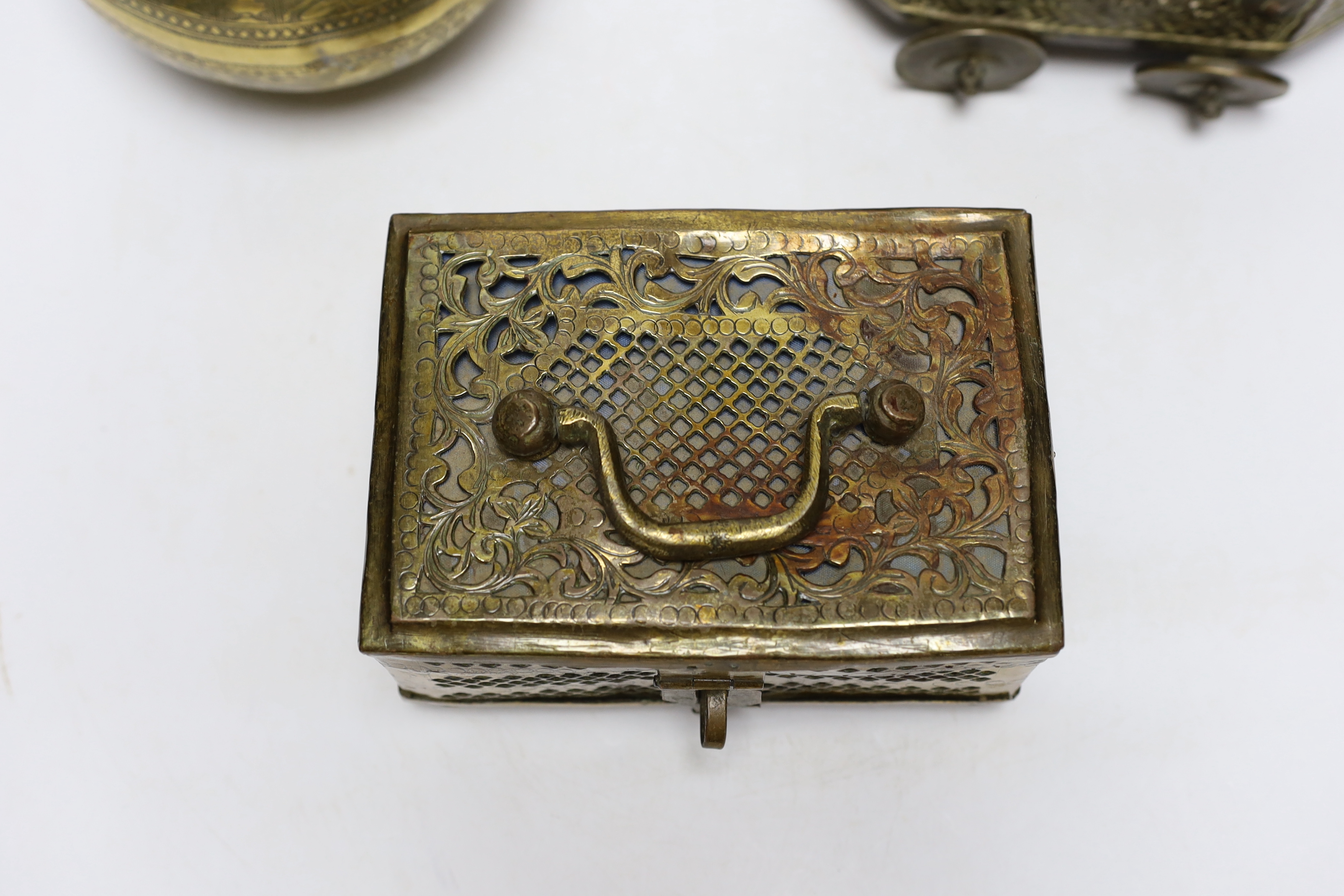 Eastern brassware to include a betel box on wheels, a vase with engraved detail and a pierced box, tallest 15.5cm (3)